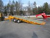 Tag along sliding axle trailer
